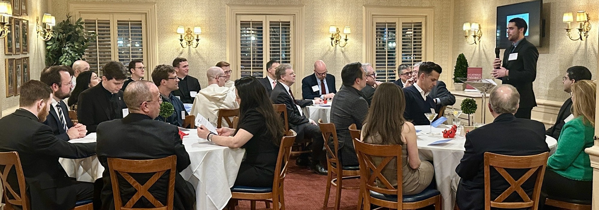 A gathering of people for a dinner for the Basselin Program