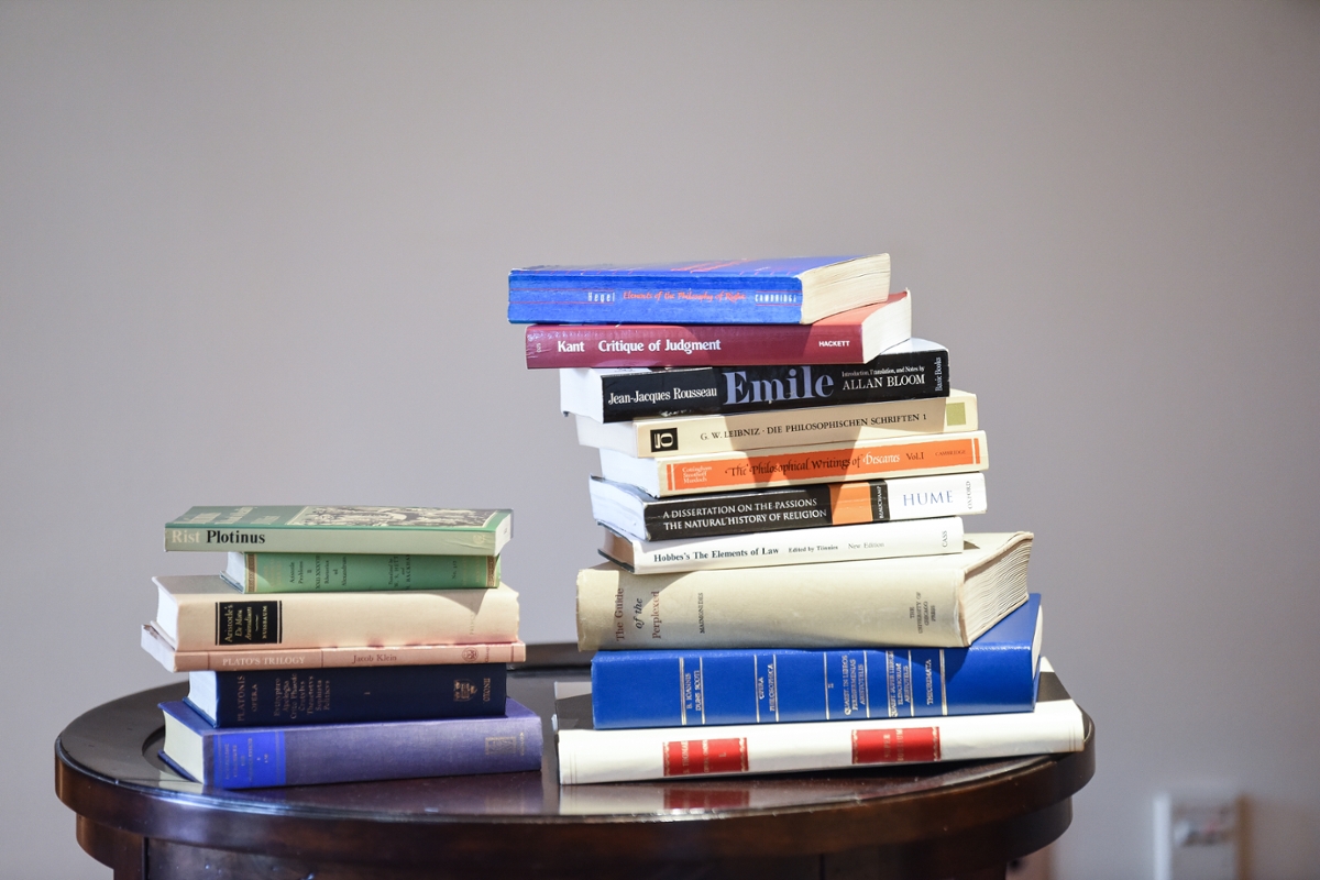 Philosophy books stacked on a table