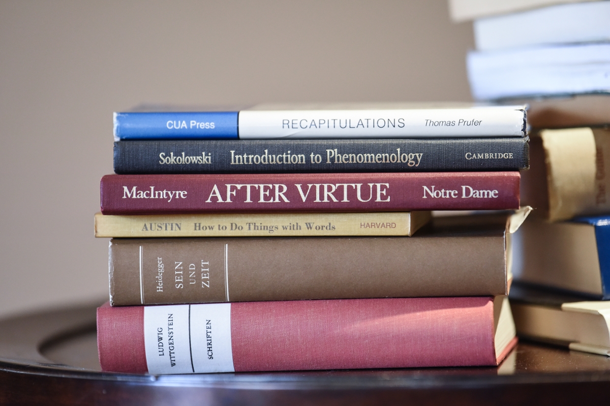 Philosophy books stacked on a desk