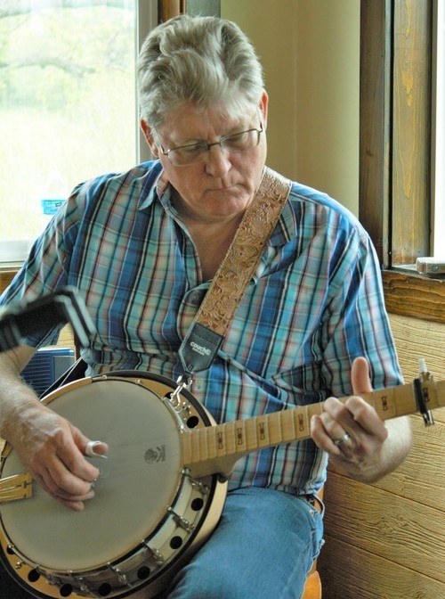 Tim playing a banjo.